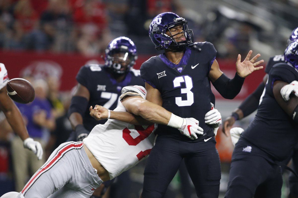 Sep 15, 2018; Arlington, TX, USA; Ohio State Buckeyes defensive end Nick Bosa (97) strips TCU Horned Frogs quarterback Shawn Robinson (3) of the ball in the first quarter at AT&T Stadium. Mandatory Credit: Tim Heitman-USA TODAY Sports