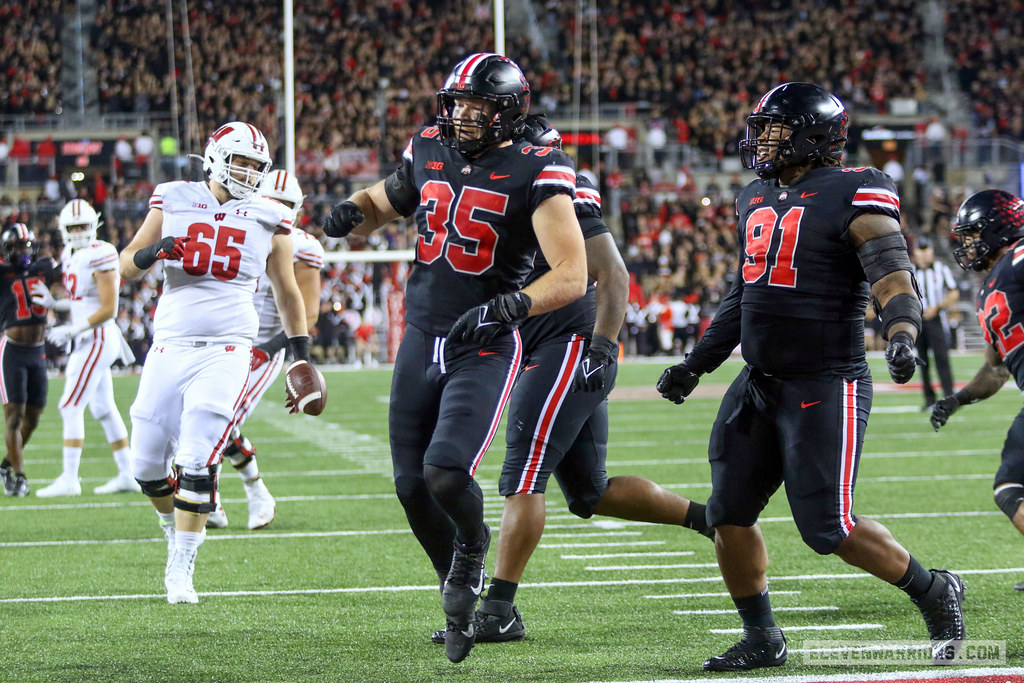 Defensive personnel Tommy Eichenberg and Tyleik Williams of The Ohio State Buckeyes