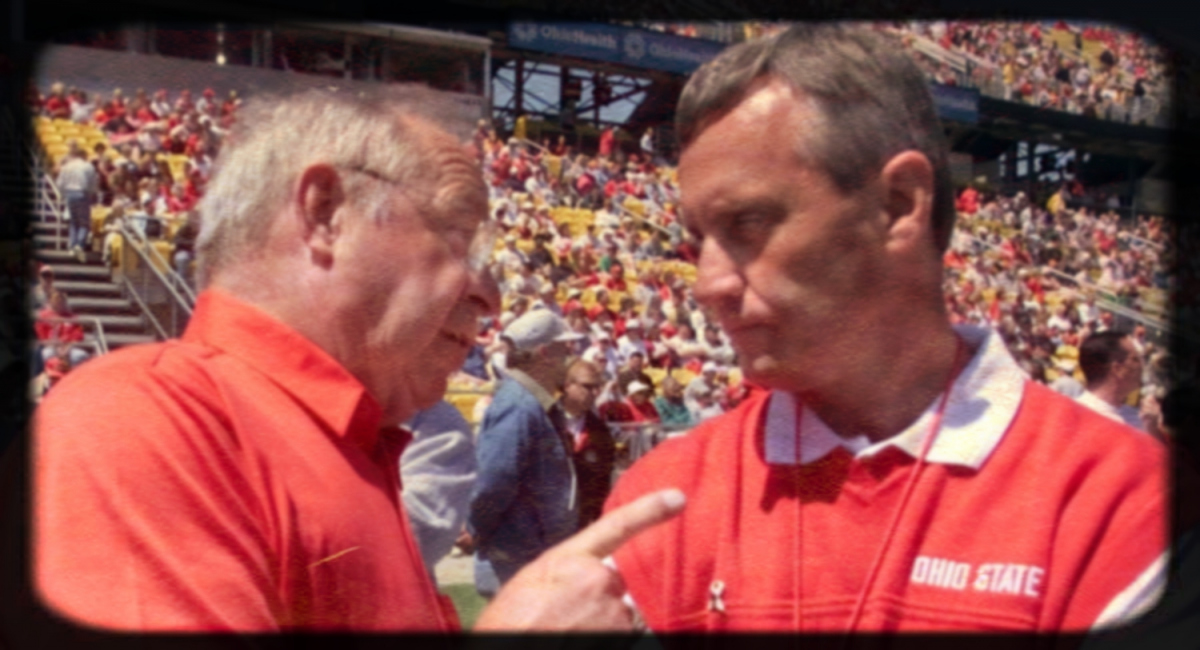 His old boss Earle Bruce, under whom Jim Tressel was an assistant coach at Ohio State, talks to Tressel before the annual spring game, held in Crew Stadium on April 28, 2001. Osu Dciii Bruce Tressel
