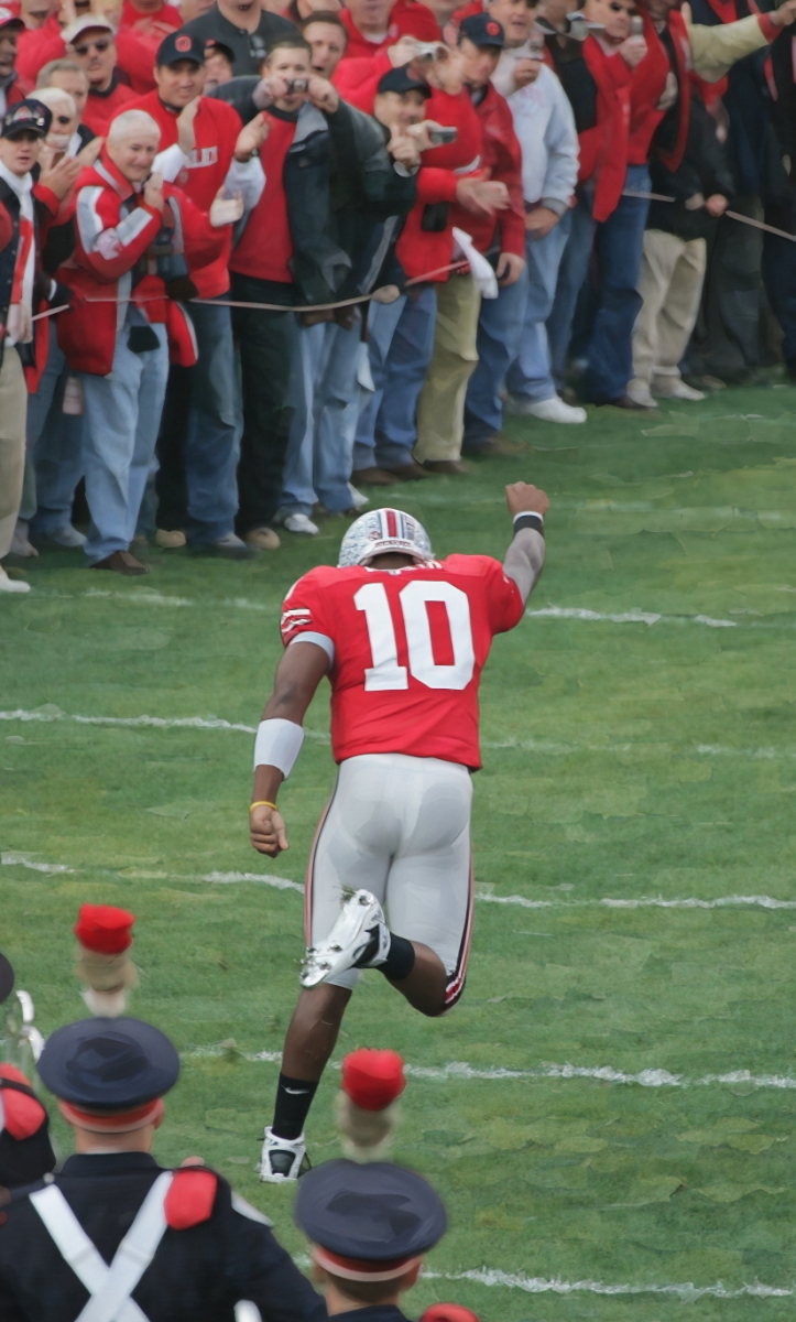 Ohio State's Troy Smith, 10, makes his run down the field as he is introduced during a ceremony for the seniors last game at the Ohio Stadium, November 18, 2006. (Dispatch photo by Neal C. Lauron) Ncl Biggame 36