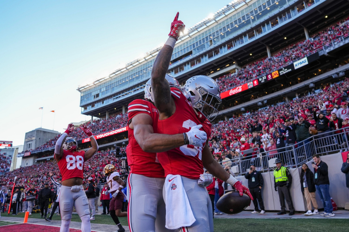 Nov 18, 2023; Columbus, Ohio, USA; Ohio State Buckeyes running back TreVeyon Henderson (32) celebrates a touchdown with wide receiver Emeka Egbuka (2) during the first half of the NCAA football game against the Minnesota Golden Gophers at Ohio Stadium.