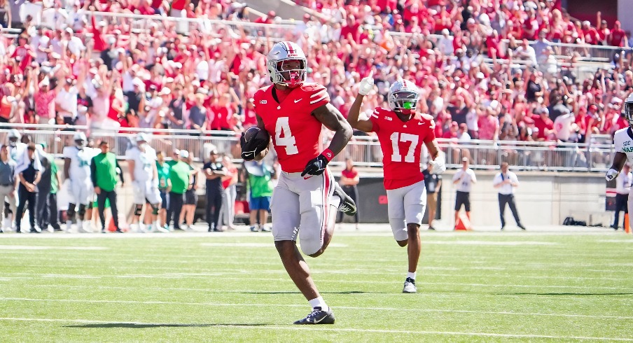 Sep 21, 2024; Columbus, Ohio, USA; Ohio State Buckeyes wide receiver Jeremiah Smith (4) runs the ball in for a touchdown against the Marshall Thundering Herd in the second half at Ohio Stadium on Saturday.