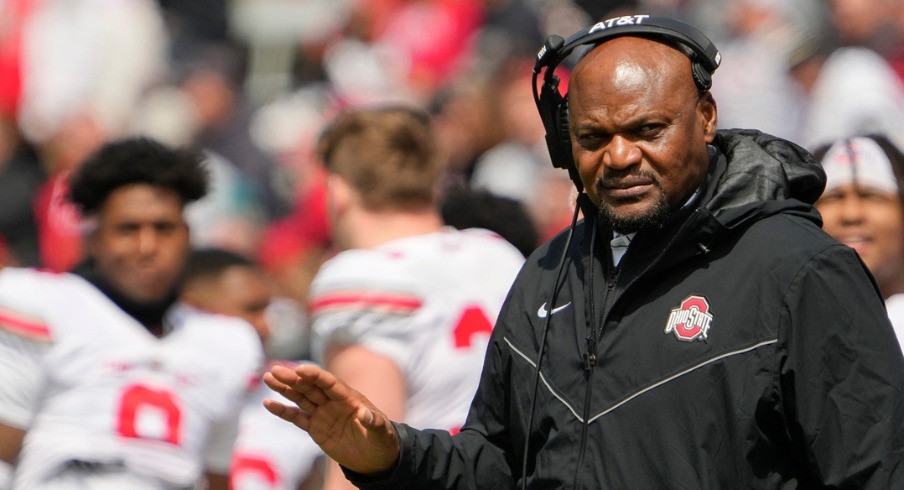 Ohio State Buckeyes defensive line coach Larry Johnson motions to players during the spring football game at Ohio Stadium in Columbus on April 16, 2022. Ncaa Football Ohio State Spring Game