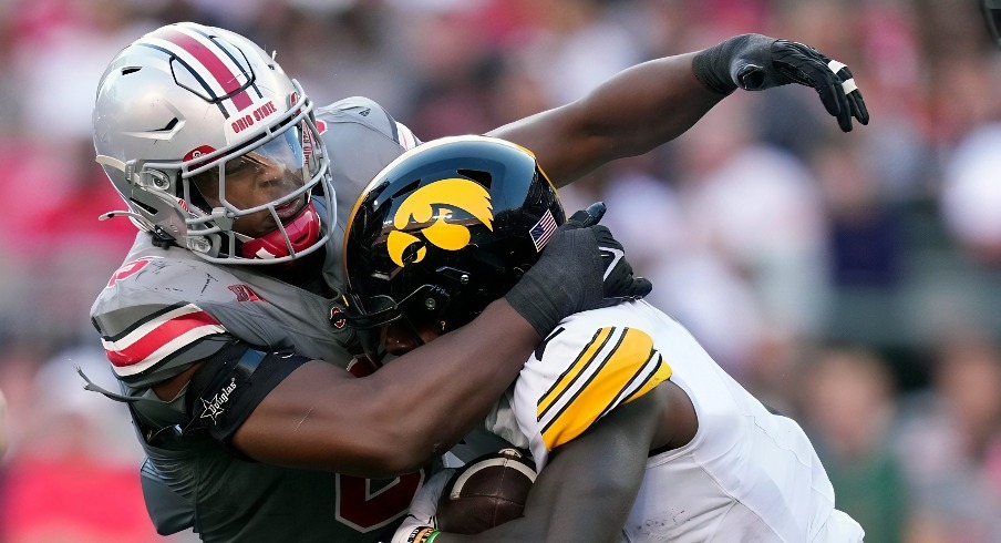 Oct 5, 2024; Columbus, OH, USA; Ohio State Buckeyes safety Sonny Styles (6) tackles Iowa Hawkeyes running back Kaleb Johnson (2) in the back field in the third quarter during the NCAA football game at Ohio Stadium.