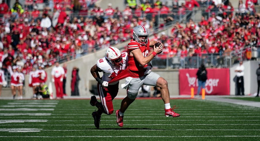 Ohio State Buckeyes quarterback Will Howard (18) gets tackled by Nebraska Cornhuskers linebacker MJ Sherman (48) on a run during the second quarter of their game at Ohio Stadium on Oct 26, 2024, in Columbus.