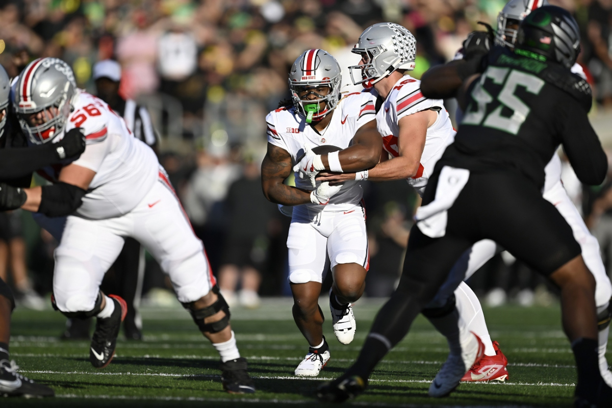 Oct 12, 2024; Eugene, Oregon, USA; Ohio State Buckeyes quarterback Will Howard (18) hands off to running back Quinshon Judkins (1) during the first half at Autzen Stadium. Mandatory Credit: Troy Wayrynen-Imagn Images