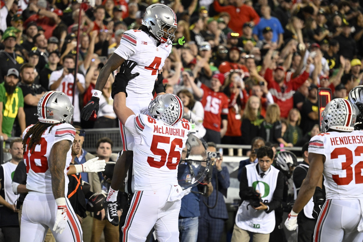 Oct 12, 2024; Eugene, Oregon, USA; Ohio State Buckeyes wide receiver Jeremiah Smith (4) celebrates scoring a touchdown with offensive lineman Seth McLaughlin (56) during the second half against the Oregon Ducks at Autzen Stadium. Mandatory Credit: Troy Wayrynen-Imagn Images