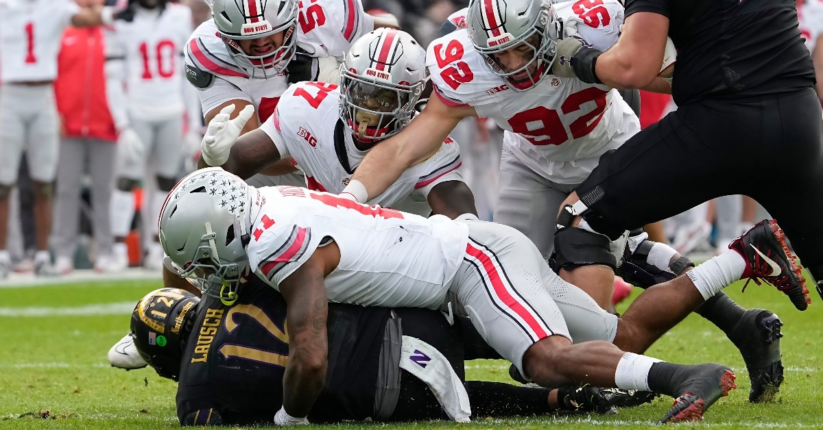 Ohio State Buckeyes linebacker C.J. Hicks (11) sacks Northwestern Wildcats quarterback Jack Lausch (12) during the second half of the NCAA football game at Wrigley Field in Chicago on Saturday, Nov. 16, 2024. Ohio State won 31-7.