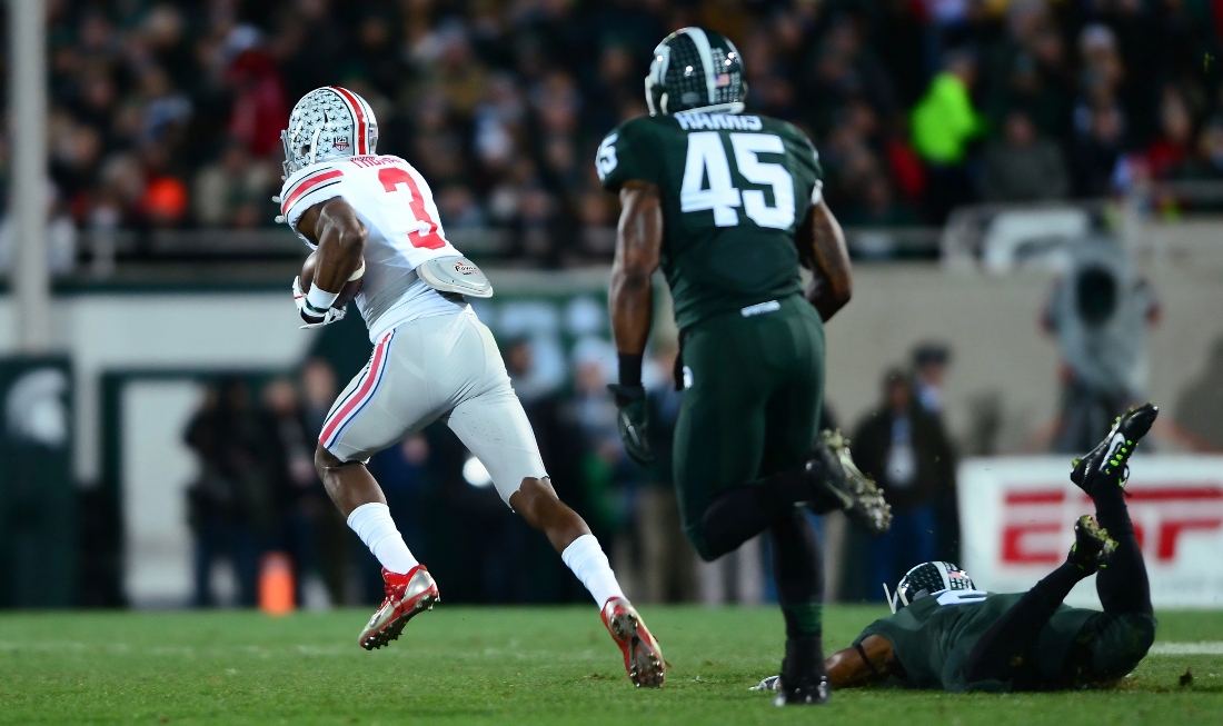 Nov 8, 2014; East Lansing, MI, USA; Ohio State Buckeyes wide receiver Michael Thomas (3) makes a catch while being defended by Michigan State Spartans cornerback Darian Hicks (2) and runs to the end zone for a touchdown during the second quarter at Spartan Stadium. Mandatory Credit: Andrew Weber-Imagn Images