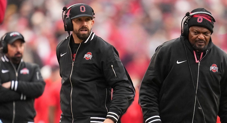 Ohio State Buckeyes assistant coaches James Laurinaitis, left, and Larry Johnson watch from the sideline during the NCAA football game against the Indiana Hoosiers at Ohio Stadium in Columbus on Monday, Nov. 25, 2024. Ohio State won 38-15.