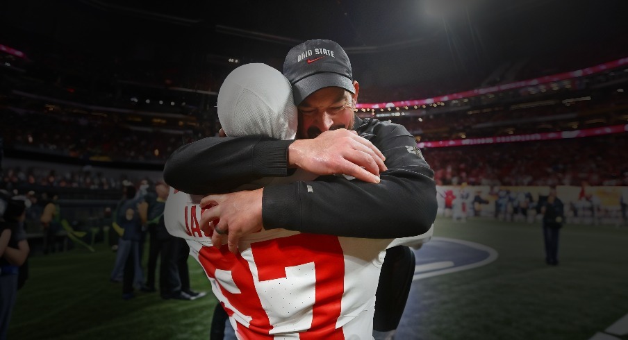 Jan 20, 2025; Atlanta, GA, USA; Ohio State Buckeyes head coach Ryan Day celebrates with Ohio State Buckeyes defensive end Kenyatta Jackson Jr. (97) after winning the CFP National Championship college football game at Mercedes-Benz Stadium. Mandatory Credit: Mark J. Rebilas-Imagn Images