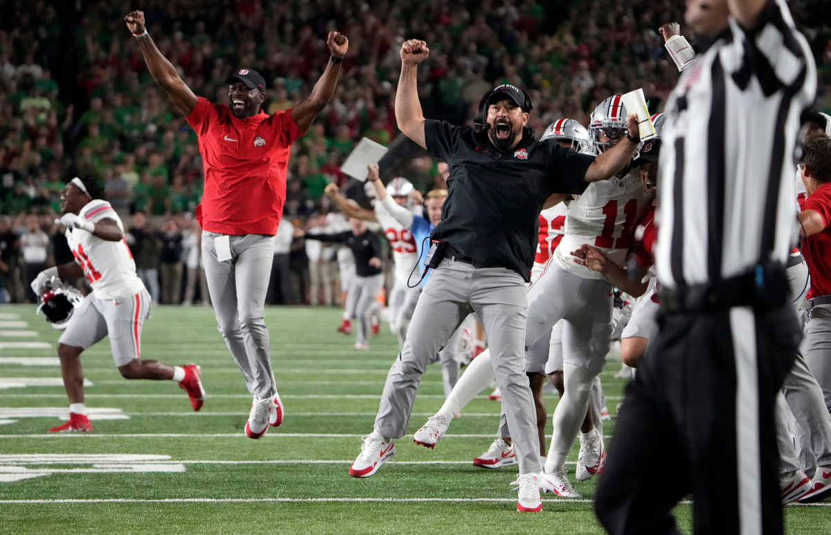 Sep 23, 2023; South Bend, Indiana, USA; Ohio State Buckeyes head coach Ryan Day celebrates Chip Trayanum (19) game winning rushing touchdown against Notre Dame Fighting Irish during the fourth quarter of their game at Notre Dame Stadium.