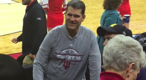 Jim Harbaugh dons Indiana shirt.