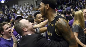 Northwestern Wildcats center Dererk Pardon (5) celebrates with fans after scoring the game winning basket against the Michigan Wolverines at Welsh-Ryan Arena.