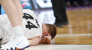 Mar 16, 2018; Detroit, MI, USA; Purdue Boilermakers center Isaac Haas (44) lays on the ground after an injury in the second half against the Cal State Fullerton Titans in the first round of the 2018 NCAA Tournament at Little Caesars Arena. Mandatory Credit: Rick Osentoski-USA TODAY Sports