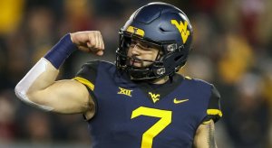 Will Grier won't play in his bowl game.