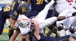 Dec 1, 2018; Berkeley, CA, USA; Stanford Cardinal running back Bryce Love (20) fumbles the ball away to the California Golden Bears defense in the fourth quarter of the 121st Big Game at California Memorial Stadium. Mandatory Credit: D. Ross Cameron-USA TODAY Sports