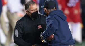 Nov 21, 2020; Piscataway, New Jersey, USA; Rutgers Scarlet Knights head coach Greg Schiano, left, shakes hands with Michigan Wolverines head coach Jim Harbaugh before their game at SHI Stadium. Mandatory Credit: Vincent Carchietta-USA TODAY Sports