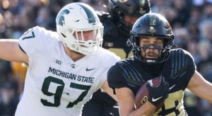 Nov 6, 2021; West Lafayette, Indiana, USA; Purdue Boilermakers wide receiver Jackson Anthrop (33) runs the ball while Michigan State Spartans defensive tackle Maverick Hansen (97) defends in the first quarter at Ross-Ade Stadium. Mandatory Credit: Trevor Ruszkowski-USA TODAY Sports