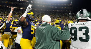 Michigan and Michigan State players get into scuffle to end the game.