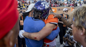 Jack Bech hugging his uncle, Brett, after his game-winning touchdown catch