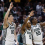 Michigan State players celebrating on the bench