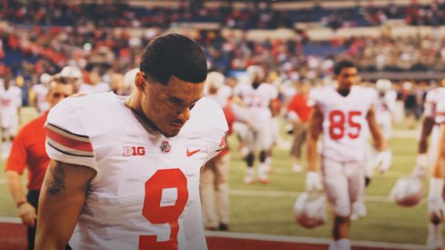 Devin Smith walks off the field dejected following Ohio State's loss to Michigan State in the Big Ten Championship Game.