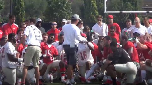 Urban Meyer speaks to his players before the first practice of fall camp.