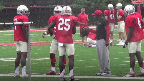 Stan Drayton works with his running backs at Ohio State fall camp practice Wednesday.