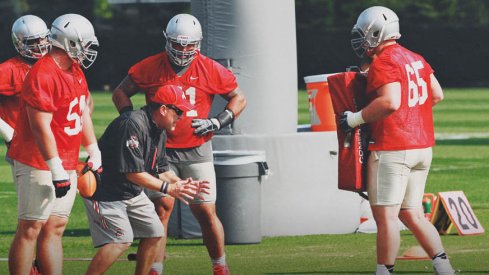 Ed Warinner coaches up his linemen at a recent Ohio State practice.