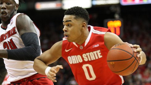 D'Angelo Russell drives by Montrezl Harrell