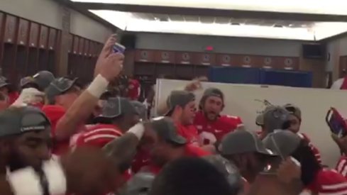 The Ohio State football team celebrates in the locker room following their 59–0 drubbing of Wisconsin.