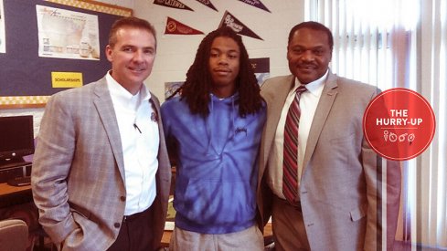 Urban Meyer, Juwuan Briscoe and Larry Johnson, Sr.