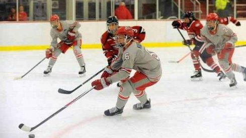 Taylor Kuehl with the puck on a string