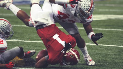 Darron Lee and Doran Grant combine for a tackle.