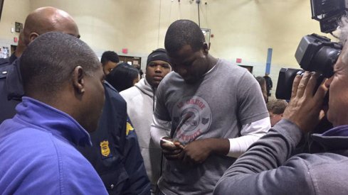 Cardale Jones signing autographs after announcing his intention to return to Ohio State for his junior season.