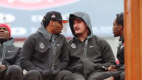 Braxton Miller and Joey Bosa talk during Ohio State's national championship celebration Saturday.