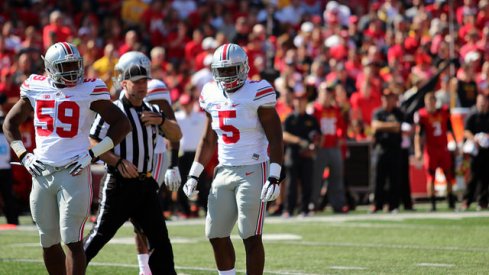 Tyquan Lewis (59) and Raekwon McMillan (5)