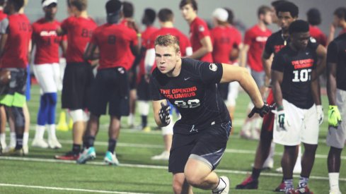 Jake Hausmann runs a route at The Opening regional camp in Columbus.