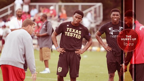 Jaylon Jones and Jeffrey Okudah receive instruction from Chris Ash and Vonn Benn