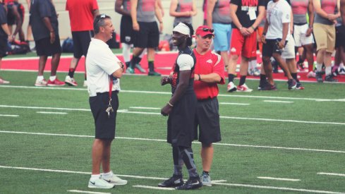 Urban Meyer, Mickey Marotti an Demario McCall at Friday Night Lights.