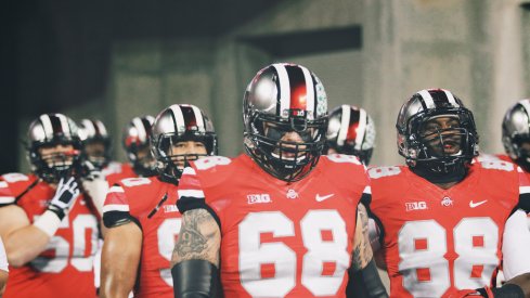 Ohio State led by Taylor Decker into Ohio Stadium.