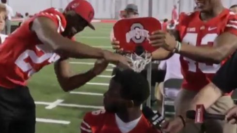 Tyvis Powell and Darron Lee slam on an unsuspecting J.T. Barrett.