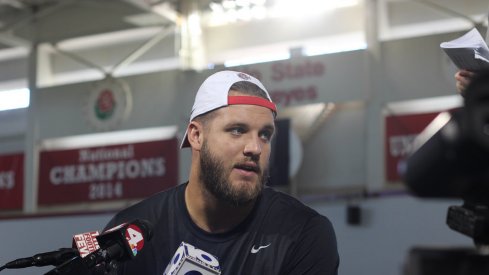 Taylor Decker meets with the media.