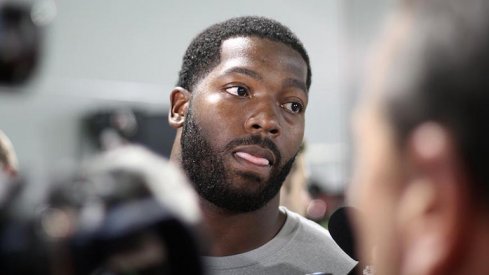 Adolphus Washington speaks to the media.