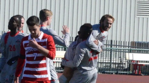 Senior Zach Mason celebrates with freshman Abdi Mohamed.