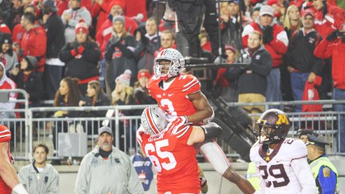 Michael Thomas celebrates a touchdown with Pat Elflein.