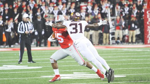 Ezekiel Elliott warding off an evil Minnesotan spirit.