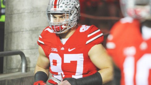 Joey Bosa runs out onto the field. 