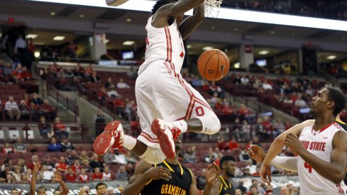 Kam Williams slams home a dunk against Grambling.